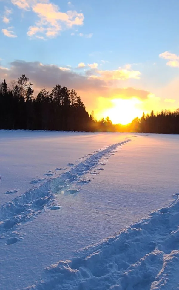 Snowshoe Trail Across Lake at Sunset
